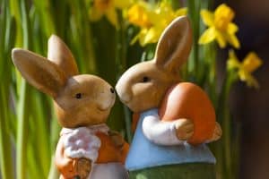 Porcelain Rabbits Holding Easter Egg